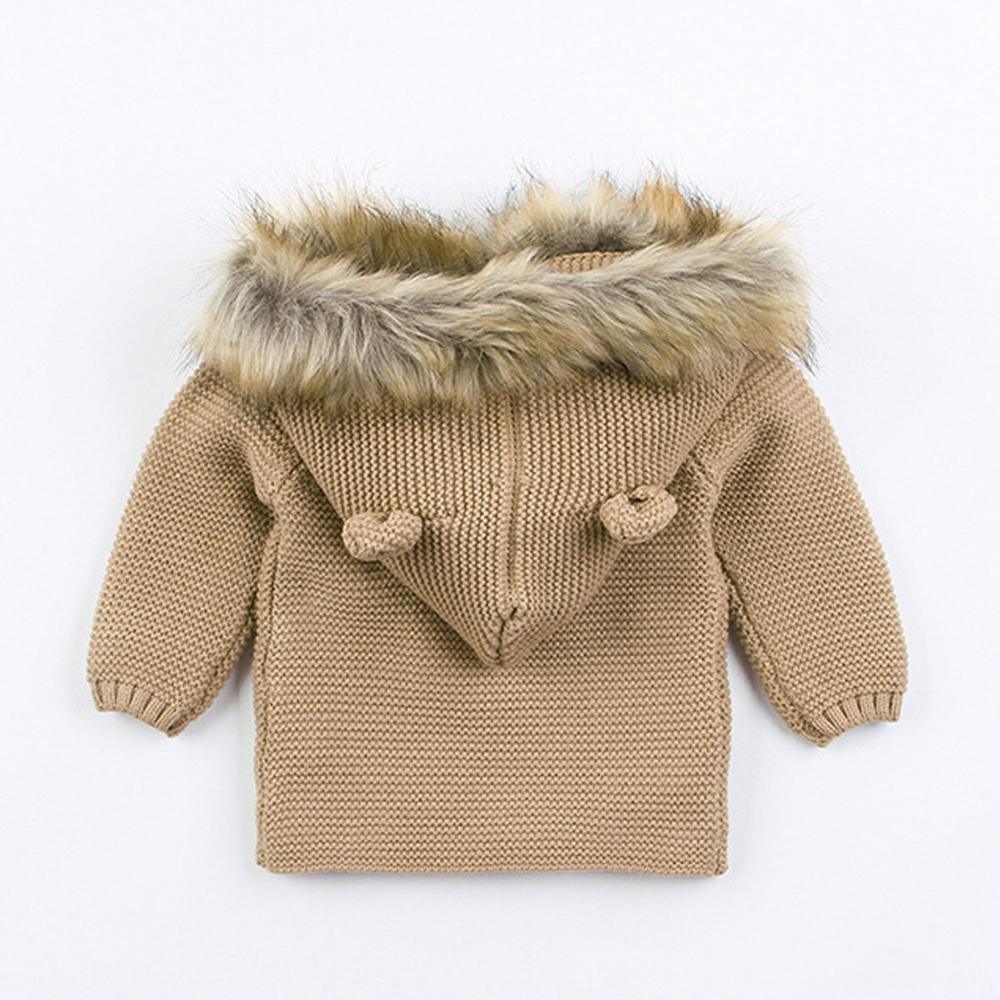 Newborn knitted hooded baby coat by Stevvex in beige with faux fur trim and knit toggles on Tampa Home & Garden Store
