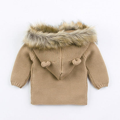 Newborn knitted hooded baby coat by Stevvex in beige with faux fur trim and knit toggles on Tampa Home & Garden Store