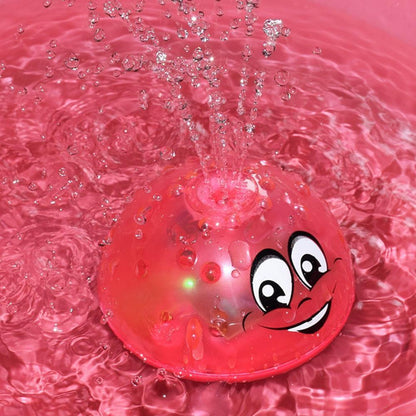 Stevvex pink bath toy sphere that sprays water with LED lights and music, smiling face on Tampa Home & Garden Store