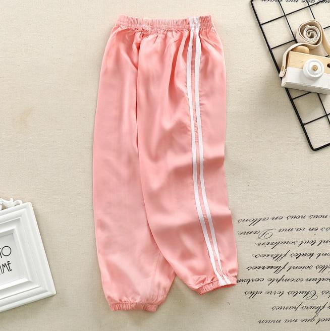 Stevvex kids pink sports pants with white side stripes, elastic waist and cuffed ankles on Tampa Home & Garden Store