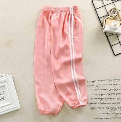 Stevvex kids pink sports pants with white side stripes, elastic waist and cuffed ankles on Tampa Home & Garden Store