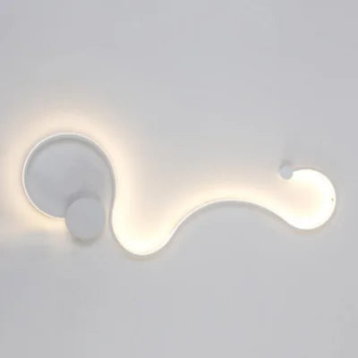 DecorBites LED aluminum wall lamp with curved wave design and white glow on Tampa Home & Garden Store