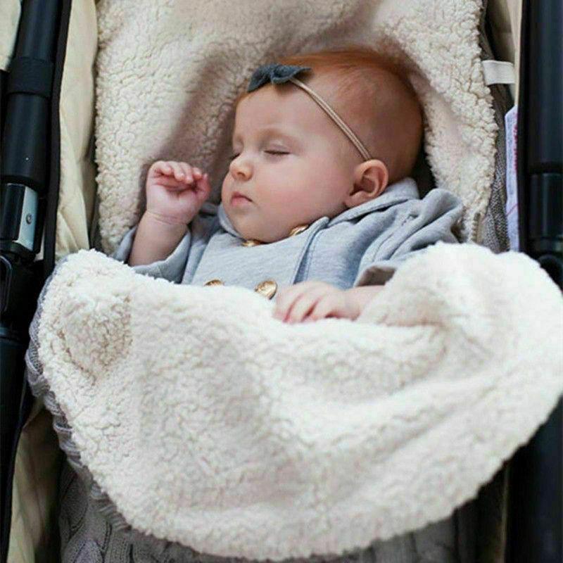 Warm baby blanket swaddle wrap in cream fluffy fleece, newborn sleeping in stroller on Tampa Home & Garden Store