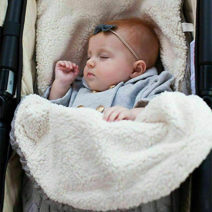 Warm baby blanket swaddle wrap in cream fluffy fleece, newborn sleeping in stroller on Tampa Home & Garden Store