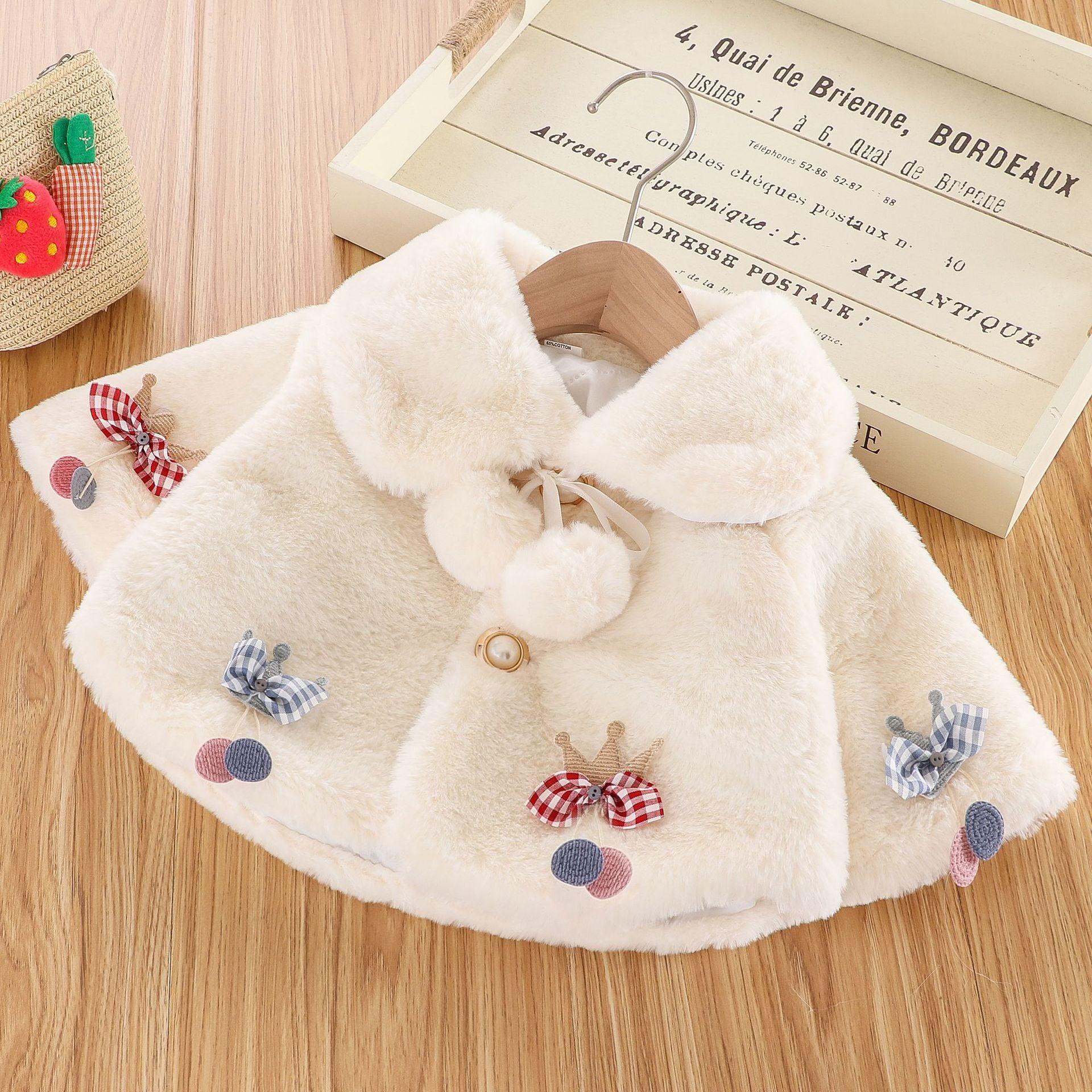 Stevvex cream plush fur baby cloak jacket with plaid bow accents on wooden hanger on Tampa Home & Garden Store