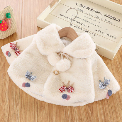Stevvex cream plush fur baby cloak jacket with plaid bow accents on wooden hanger on Tampa Home & Garden Store