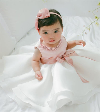 Stevvex baby dress ball gown in pink and white with bow sash and pearl necklace on Tampa Home & Garden Store