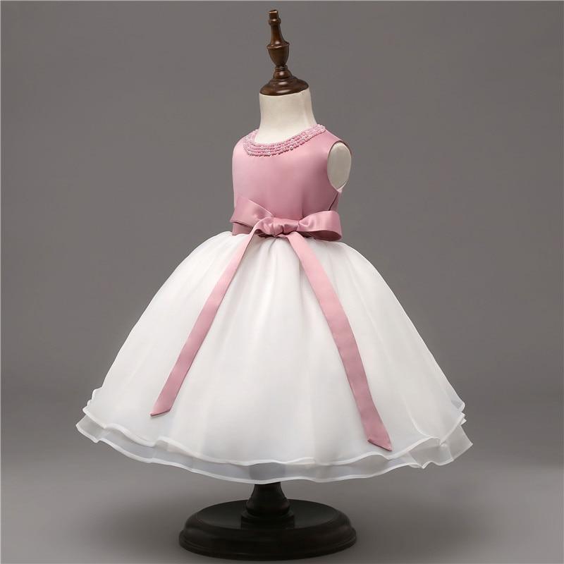 Baby christening dress with pink satin bodice and white tulle ball gown skirt sash bow on Tampa Home & Garden Store