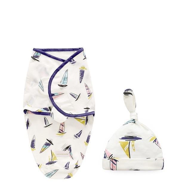 Newborn swaddle wrap set by Stevvex with sailboat print, white, purple trim, hat on Tampa Home & Garden Store