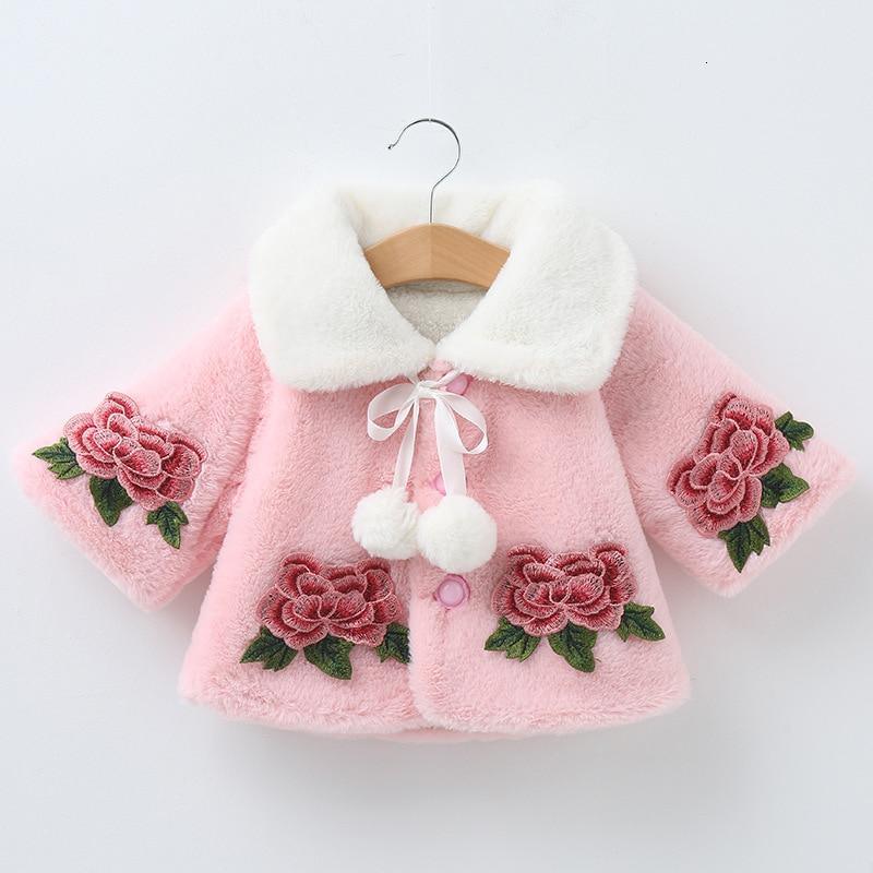 Pink baby coat by Stevvex with white faux fur collar, rose embroidery on sleeves, bow ties on Tampa Home & Garden Store