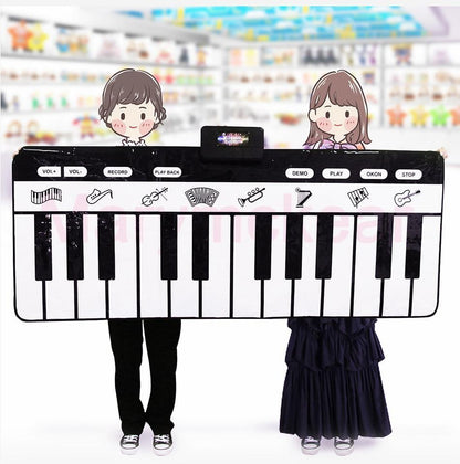 Electronic piano mat keyboard play mat by Stevvex, large black-and-white keys, two kids hold it on Tampa Home & Garden Store