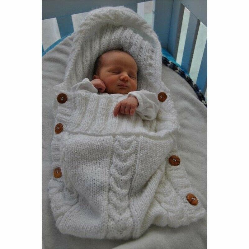 Stevvex knitted baby swaddle blanket in white with hood and wooden button trim on Tampa Home & Garden Store