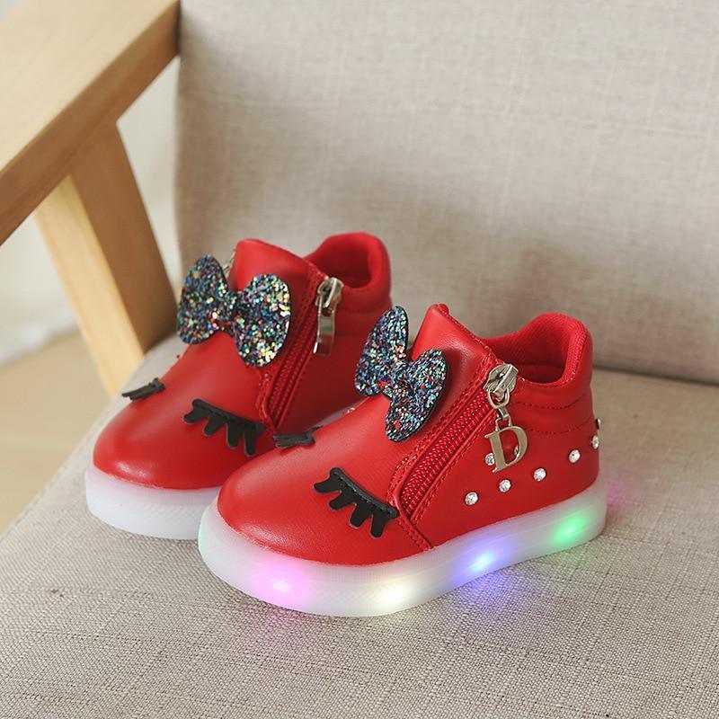 Red glowing LED baby sneakers pair with glitter bow, eyelash accents, Stevvex on Tampa Home & Garden Store