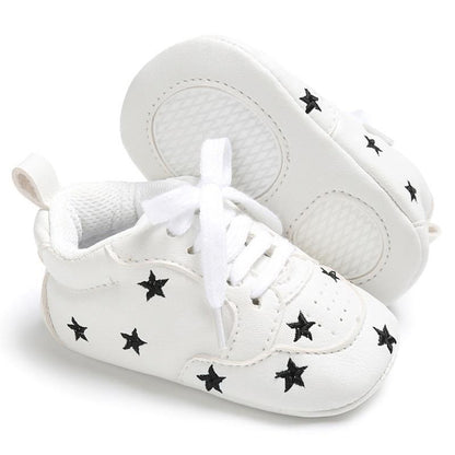 Newborn Stevvex star lace-up sneakers, white PU leather with black stars, soft sole pair on Tampa Home & Garden Store