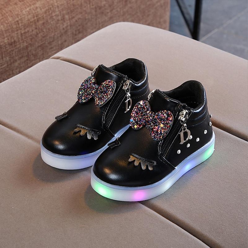 Glowing baby girl sneakers by Stevvex with glitter bow, black upper, side zipper, LED sole on Tampa Home & Garden Store