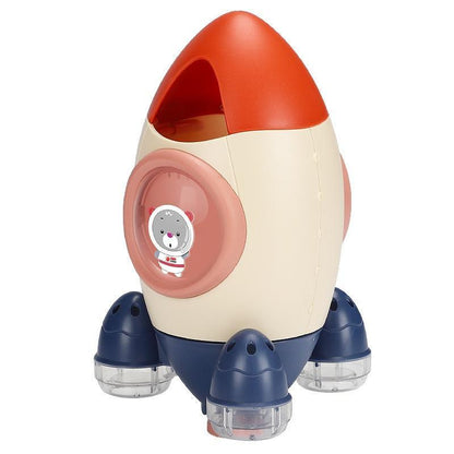 Stevvex Baby Spin Water Spray Rocket Bath Toy cream body orange cap blue legs sticker on Tampa Home & Garden Store