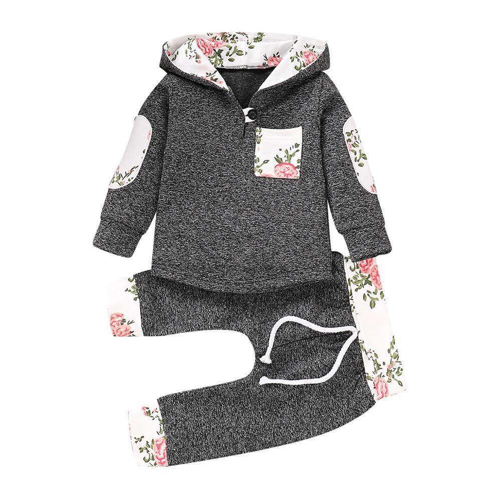 Newborn Stevvex hoodie and pant 2pc outfit in dark heather knit with floral patches on sleeves and hood lining on Tampa Home & Garden Store