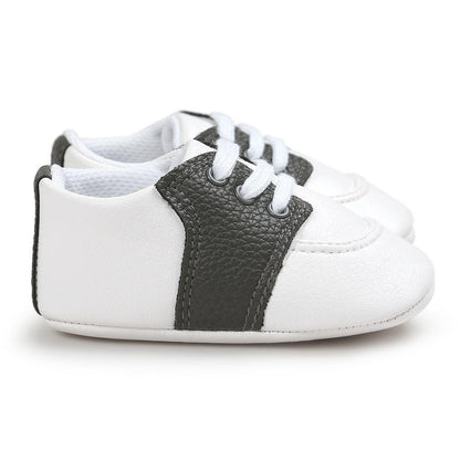 Newborn Stevvex white PU leather sneakers with black panel, lace-up, soft sole on Tampa Home & Garden Store