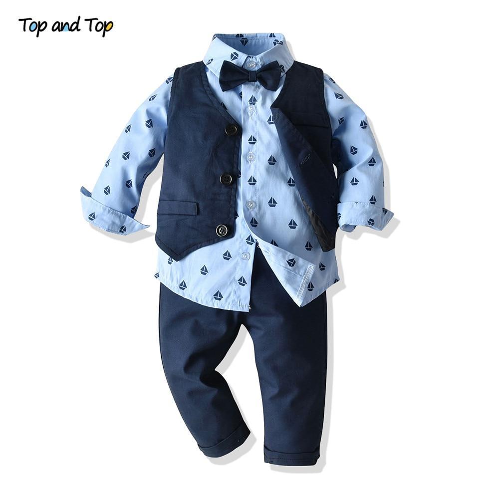 Luxury baby boy bowtie suit set by Stevvex with blue sailboat shirt, navy vest and pants on Tampa Home & Garden Store