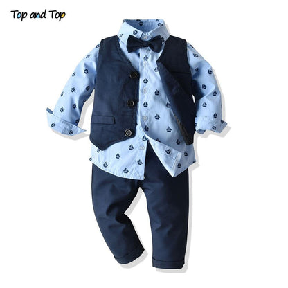 Luxury baby boy bowtie suit set by Stevvex with blue sailboat shirt, navy vest and pants on Tampa Home & Garden Store