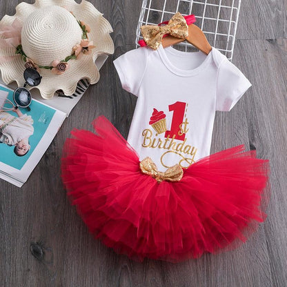 White baby onesie with 1st Birthday gold script, red tulle tutu, gold bow accents on Tampa Home & Garden Store