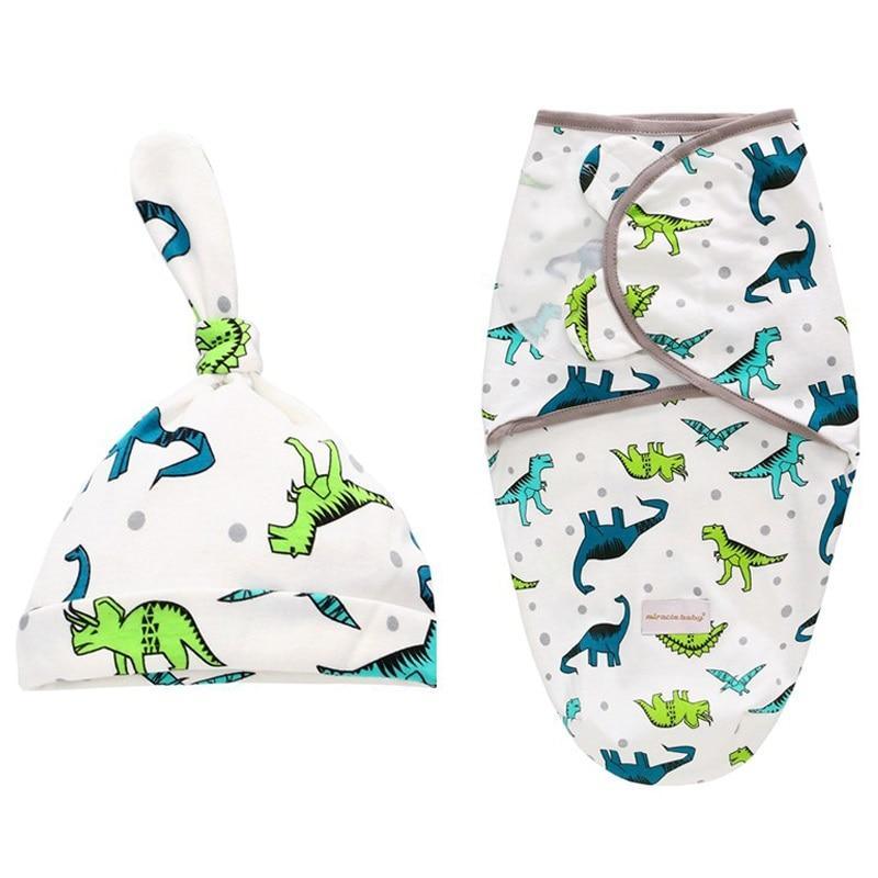 Newborn swaddle wrap and hat set by Stevvex with blue and green dinosaur print on Tampa Home & Garden Store