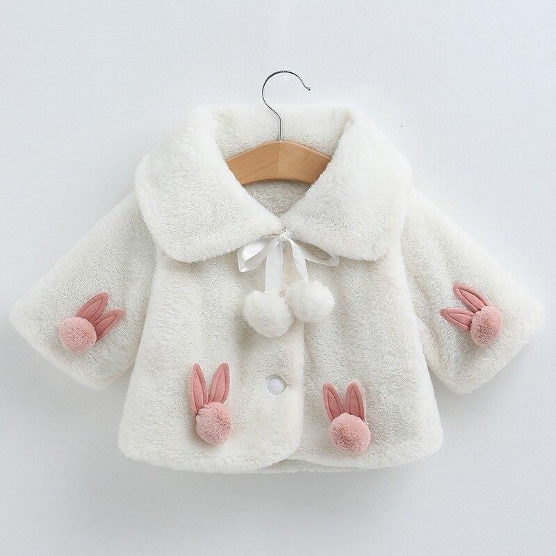 Stevvex baby girls white faux fur coat with pink bunny pockets and pom pom ties on Tampa Home & Garden Store