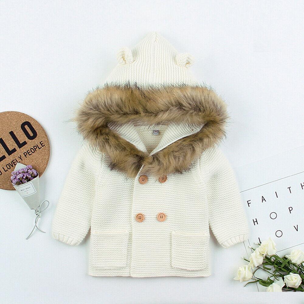 Knit hooded newborn baby coat by Stevvex with fur collar, cream color, wooden buttons on Tampa Home & Garden Store