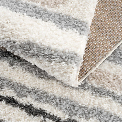 Zoya Irregular Striped Area Rug fluffy white and gray shag with beige woven border on Tampa Home & Garden Store