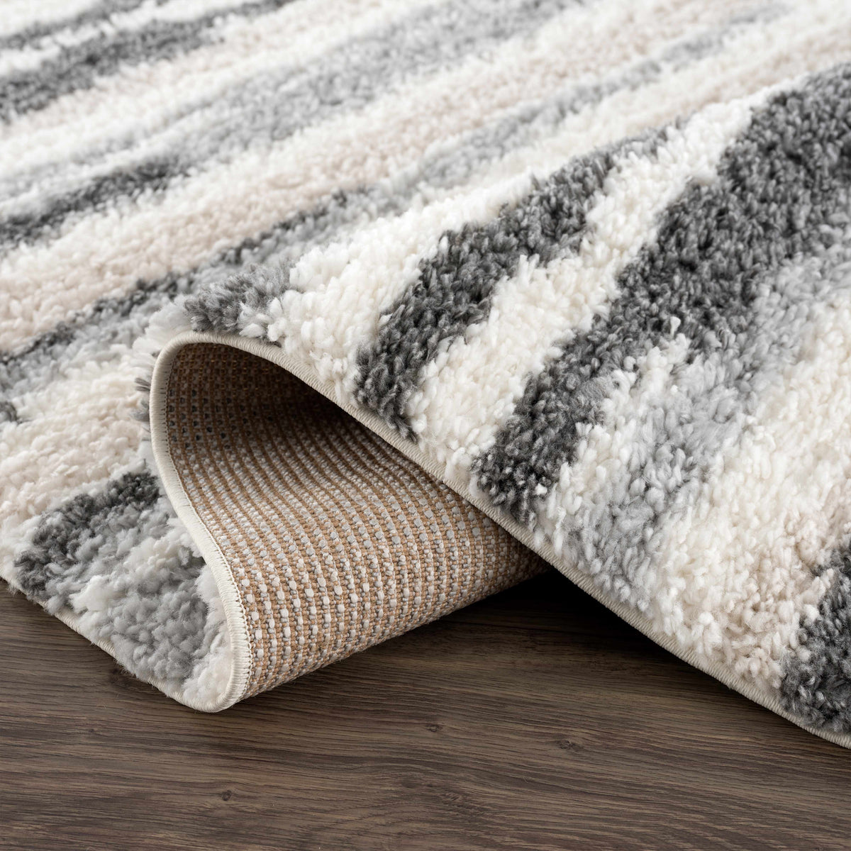 Zoya irregular striped area rug by Boutique Rugs; plush cream gray beige shag on Tampa Home & Garden Store