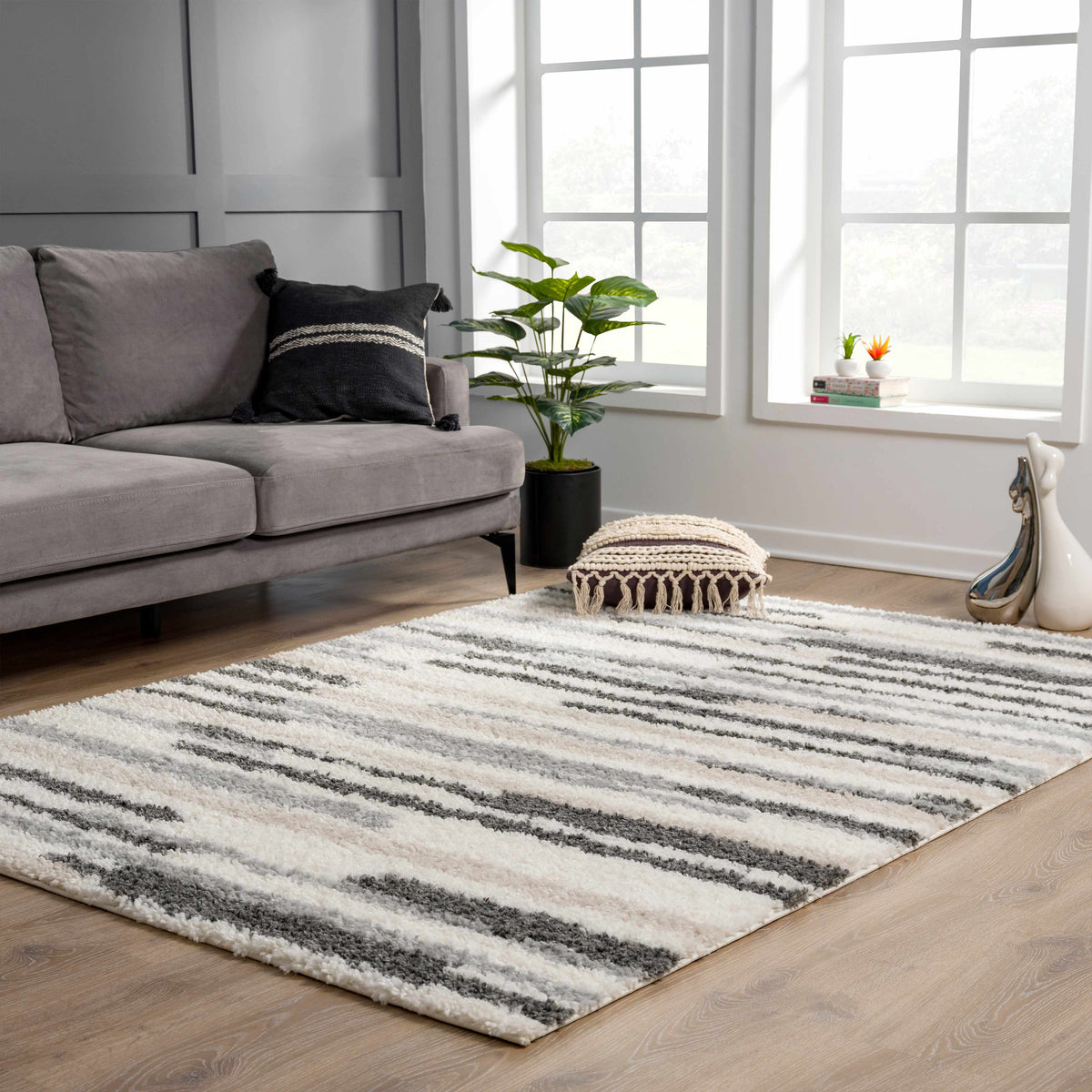 Zoya Irregular Striped Area Rug in gray and white with plush textured pile by Boutique Rugs on Tampa Home & Garden Store