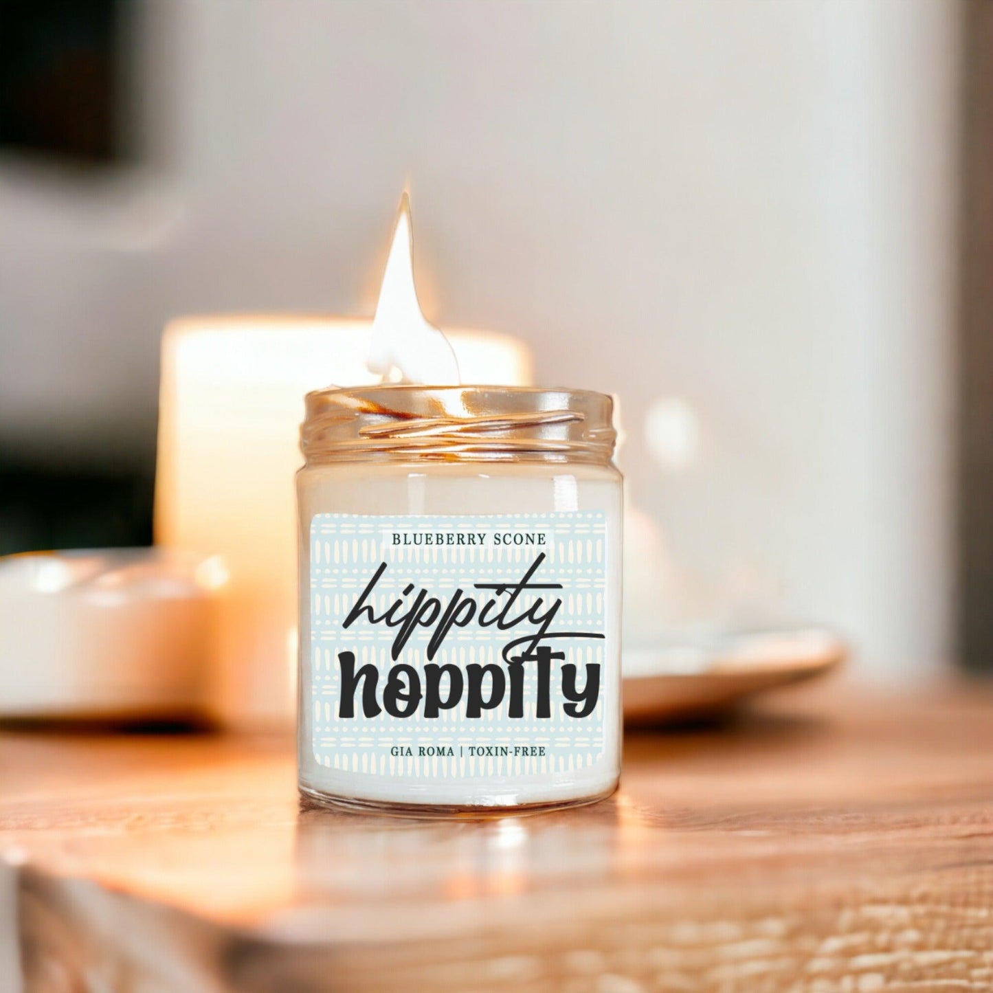 Blueberry Scone candle Gia Roma in a clear glass jar with a blue patterned label and lit wick on Tampa Home & Garden Store