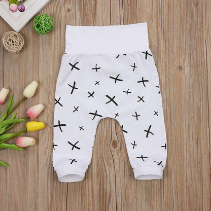 Stevvex baby pants 0-24M white trousers with black X print, elastic waistband, cuffed ankles on Tampa Home & Garden Store