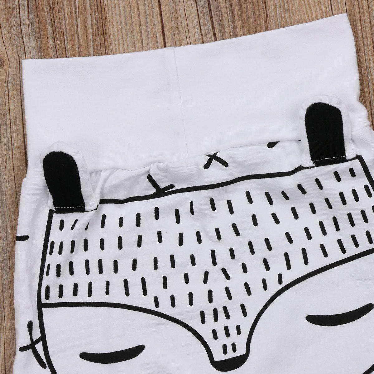 Stevvex baby pants 0-24M white trousers with bold black cartoon animal print on Tampa Home & Garden Store