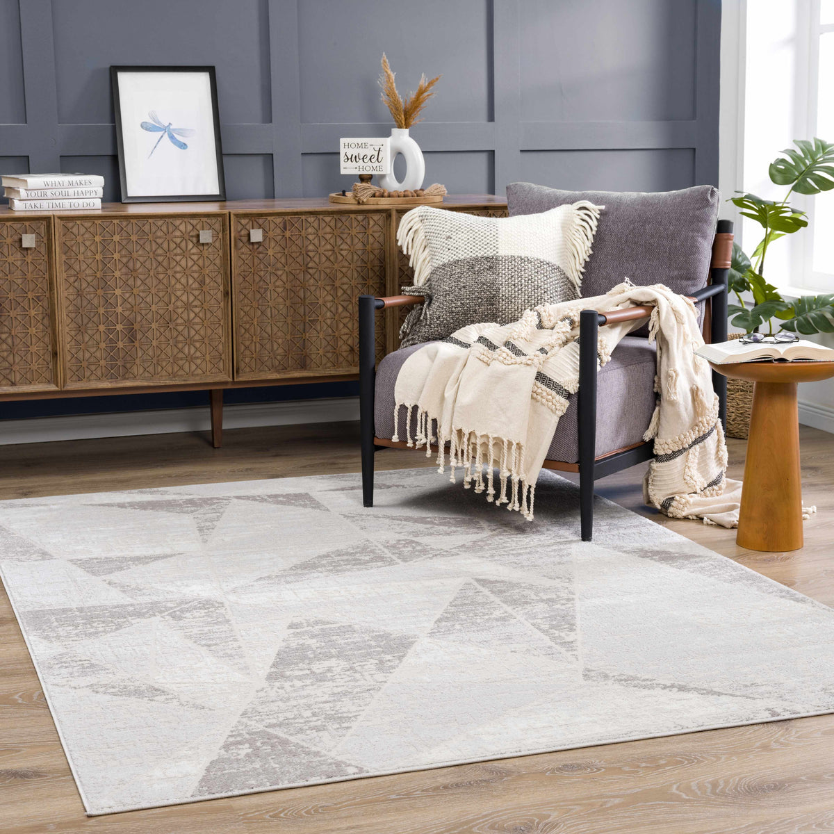 Basia Area Rug clearance light gray with subtle pattern in living room setting Boutique Rugs on Tampa Home & Garden Store