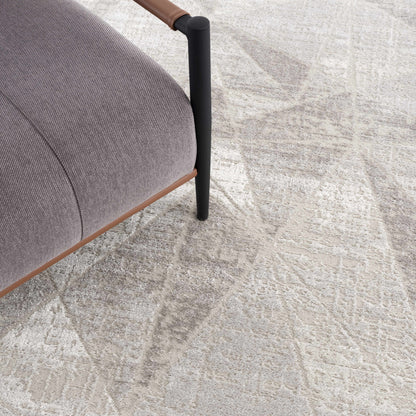 Basia area rug light beige with subtle pattern Boutique Rugs under chair leg on Tampa Home & Garden Store