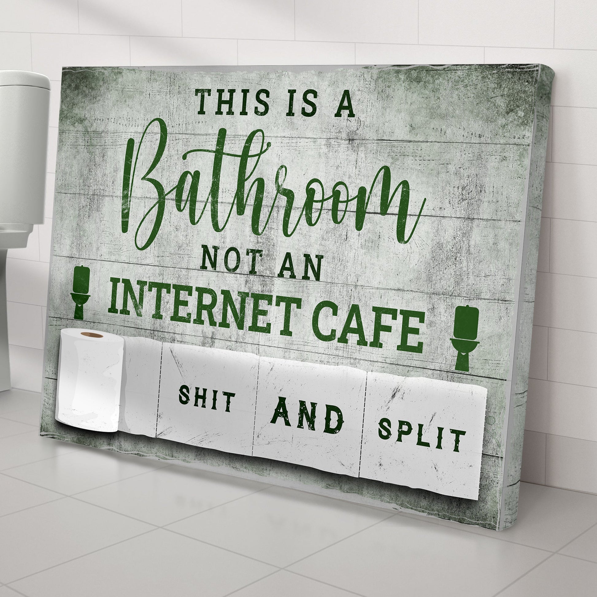 Canvas sign This Is A Bathroom Not An Internet Cafe in green script on distressed backdrop on Tampa Home & Garden Store