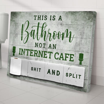Canvas sign This Is A Bathroom Not An Internet Cafe in green script on distressed backdrop on Tampa Home & Garden Store