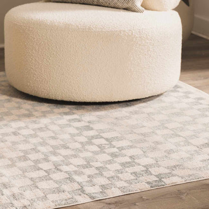 Benjy cream & light blue checkered area rug with plush tufted texture on wood floor on Tampa Home & Garden Store