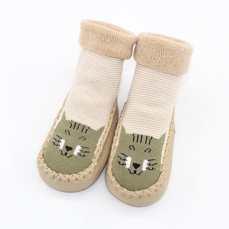 Baby warm stretchy booties with rubber soles by Stevvex, beige knit, cat-face design pair on Tampa Home & Garden Store