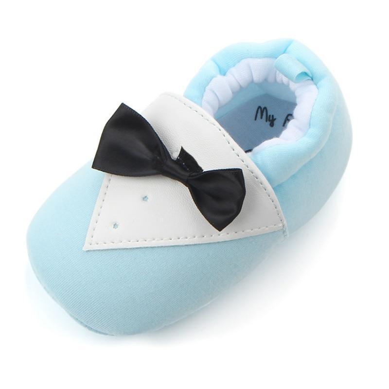 Stevvex baby first walker shoe in light blue cotton with white triangle patch and black bow on Tampa Home & Garden Store