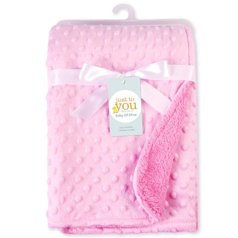 Pink baby receiving blanket with dotted plush texture and soft lining tied with satin ribbon on Tampa Home & Garden Store