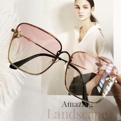 Oversize square sunglasses Stevvex with gradient pink lenses and gold frame bee accents on Tampa Home & Garden Store