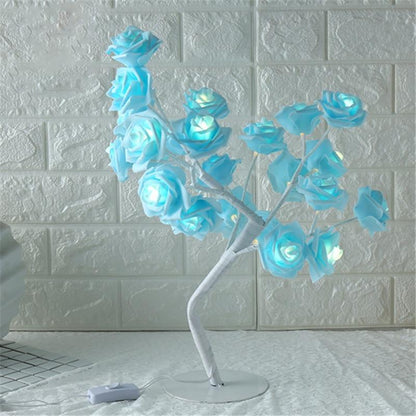 Stevvex rose-shaped LED table lamp with blue illuminated petals on white stem on Tampa Home & Garden Store