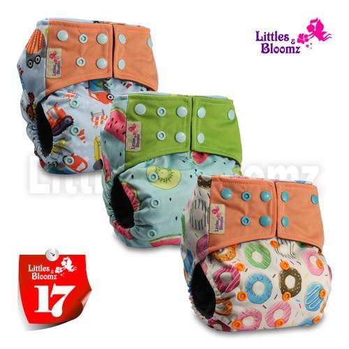 Stevvex washable cloth pocket nappies 3-pack with orange, green and donut-print designs on Tampa Home & Garden Store