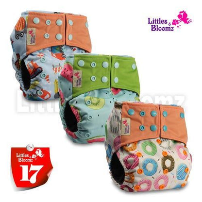 Stevvex washable cloth pocket nappies 3-pack with orange, green and donut-print designs on Tampa Home & Garden Store