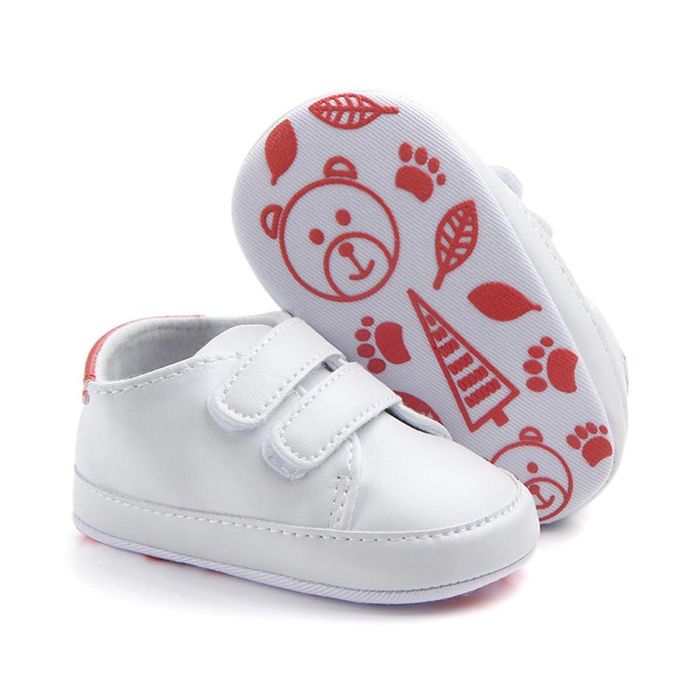 White newborn baby shoes with double Velcro straps and soft sole; pink sole with bear prints on Tampa Home & Garden Store