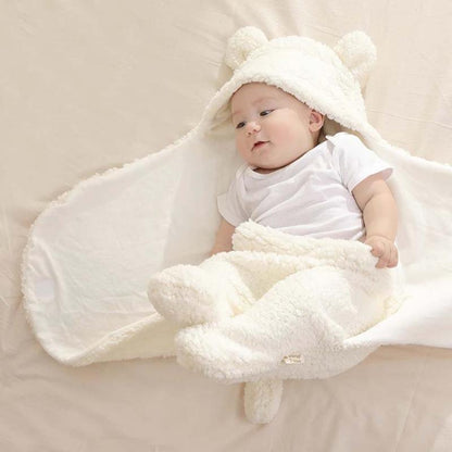 Stevvex baby blanket swaddle with bear-ear hood, ivory fleece, baby wrapped in soft envelope on Tampa Home & Garden Store
