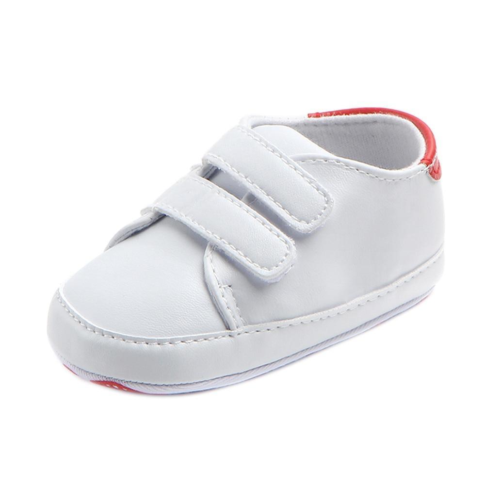 White baby shoe with red heel trim and Velcro straps Stevvex soft sole sneaker on Tampa Home & Garden Store