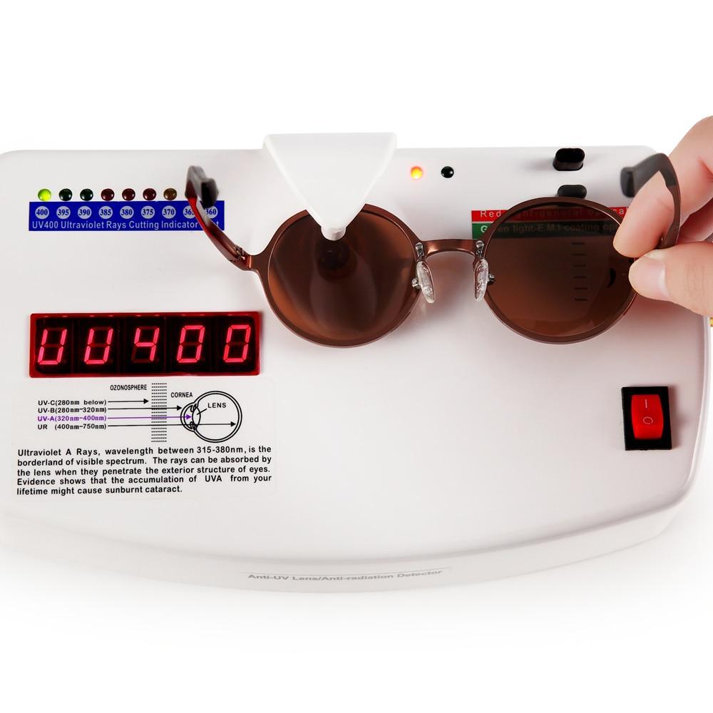 Round luxury polarized sunglasses with brown metal frame and UV400 lenses on a UV tester device on Tampa Home & Garden Store